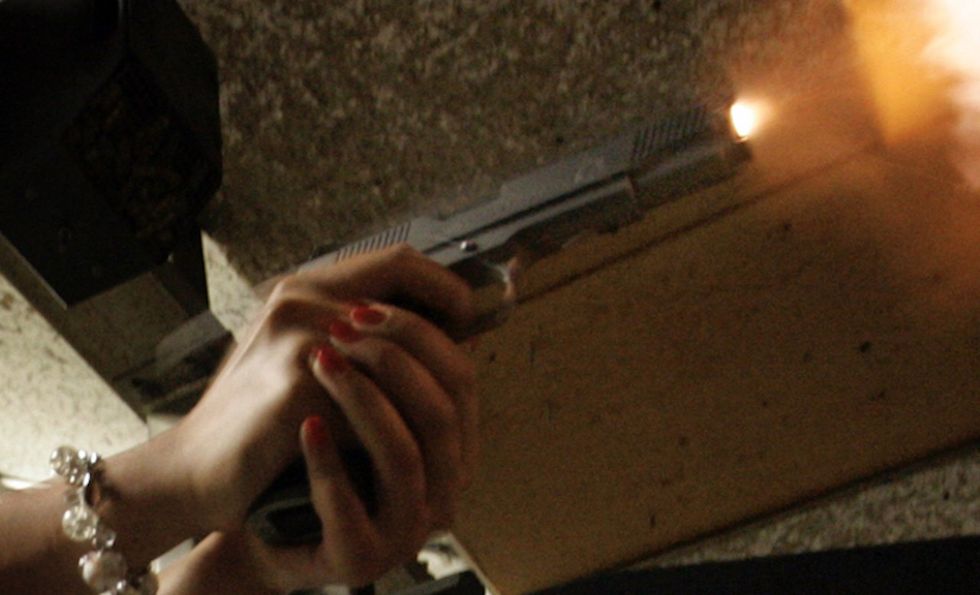 Pistol-packing Gen Z woman turns the tables on gun-toting home invaders — and she's deadly accurate