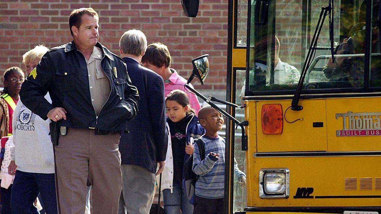 Library media teacher arrested after video recorded him putting 6-year-old in a headlock, police say