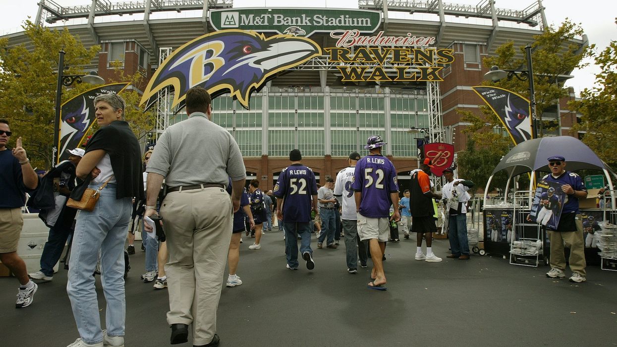Ravens fan on viral video brutally beating rival fans turns himself in, Baltimore police say