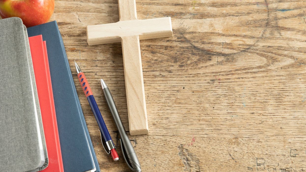 Veteran teacher suspended, faces firing for having cross by desk; law firm says school district violating free speech rights