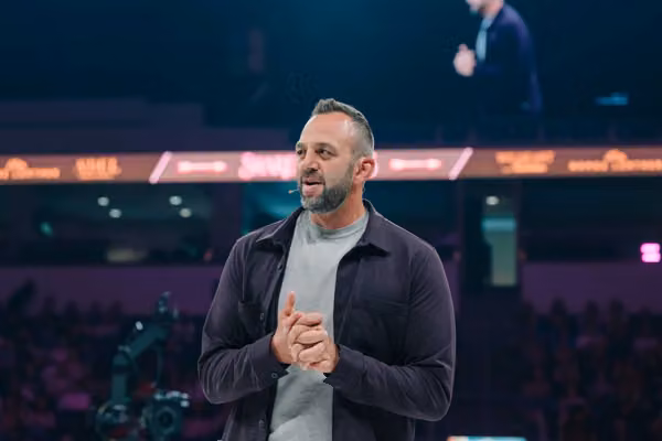 Costi Hinn makes history at Share the Arrows, urges wives to be 'crowns'
