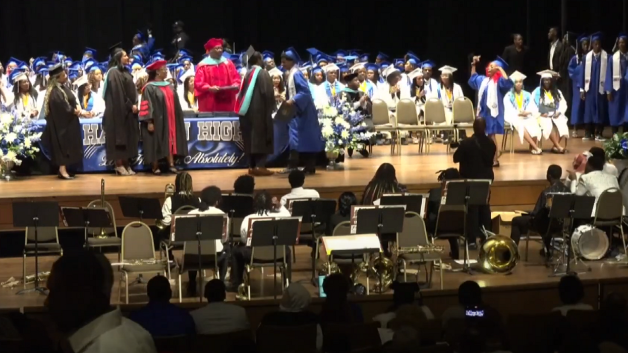 Brawl erupts during Tennessee high school graduation after a student throws up gang signs