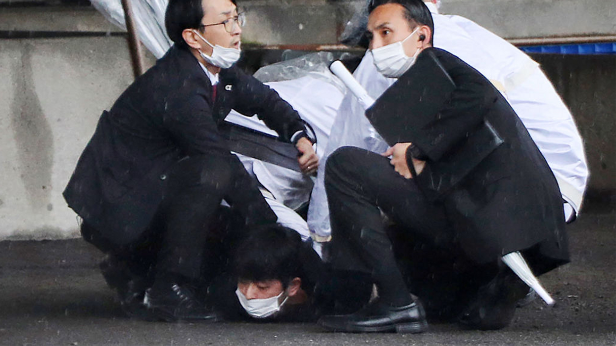 Assassination attempt on Japanese prime minister thwarted by bodyguards after would-be assassin throws pipe bomb