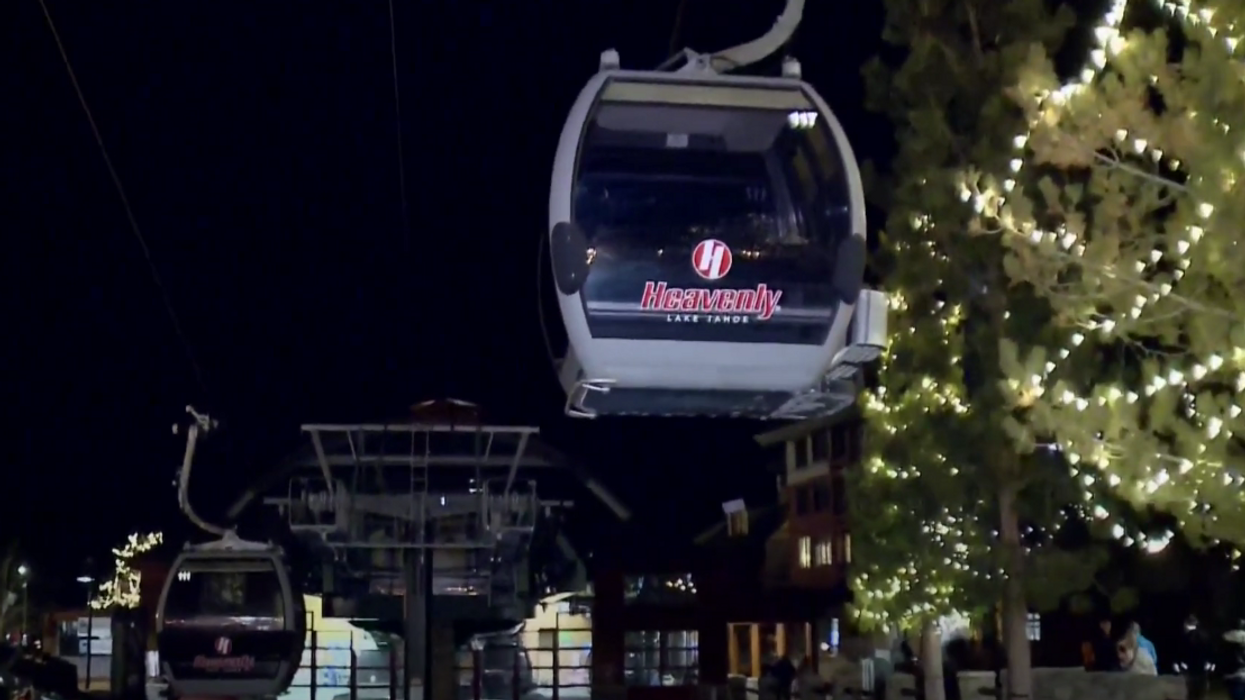 A female snowboarder spent 15 hours locked in a ski gondola in freezing temperatures, rubbed hands and feet together