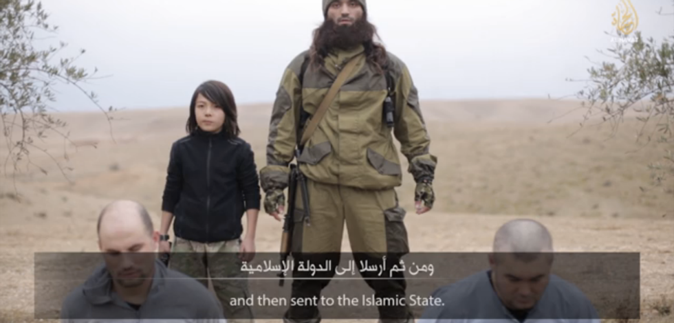 Islamic State Releases Chilling New Video Claiming to Show Young Boy Executing Two Alleged Russian Spies