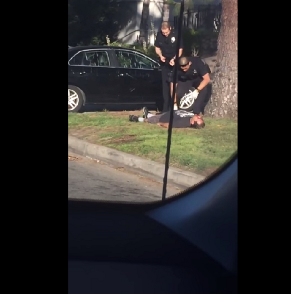 Graphic Video Shows Police Rolling Man Over to Cuff Him After He Was Shot in the Head