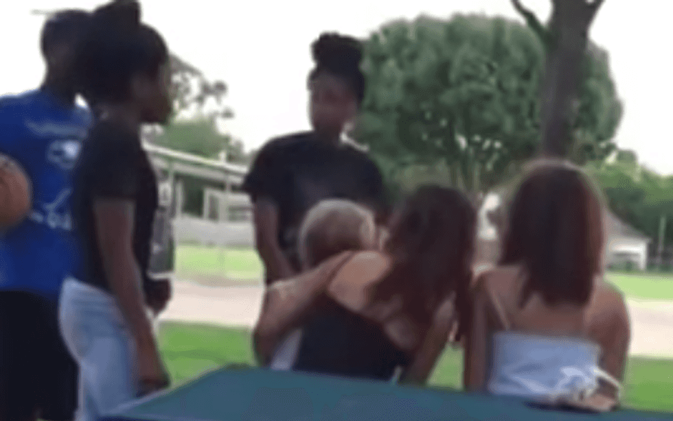 $1,000 Reward Offered for Info on This Beyond Disturbing Attack on Girl Holding Small Child