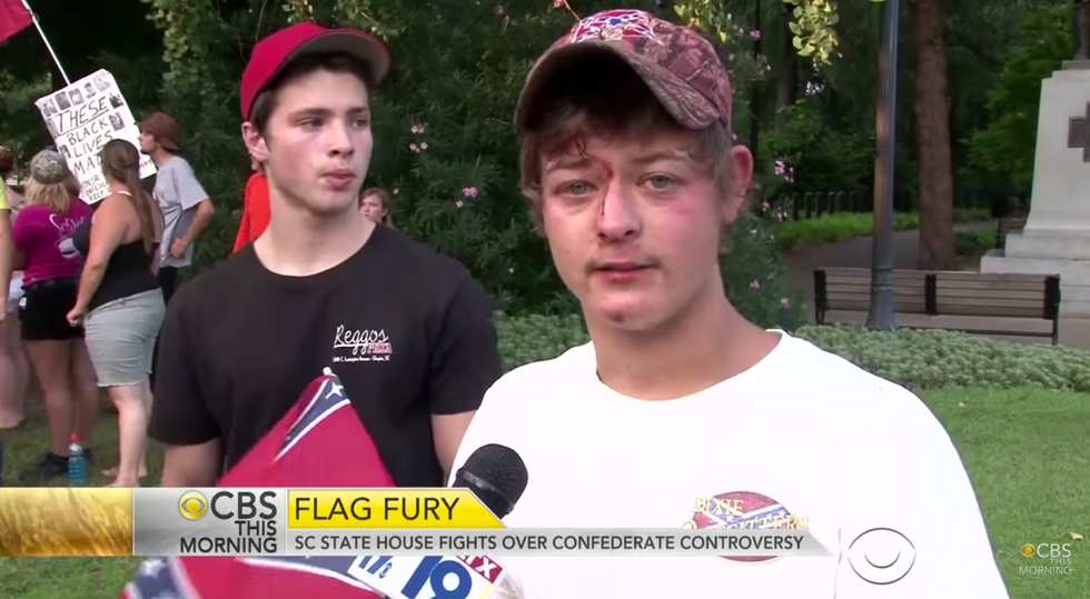 Video Captures Confederate Flag Supporter Praying With Protester — Some Time Later, His Face Looked Like This