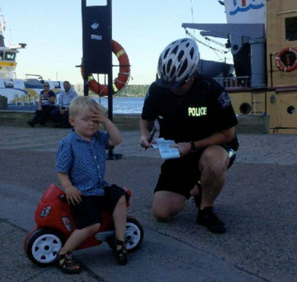 Police Teach 3-Year-Old a Lesson About Parking His Bike Responsibly...His Reaction Is Just Adorable