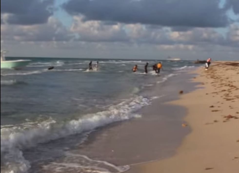 Artist Filming Model Quickly Turns Camera Toward the Water When She Notices What's Happening on a Nearby Boat