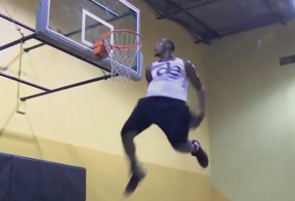 Professional dunker really does appear to 'defy gravity' with reverse 360, behind-the-back slam