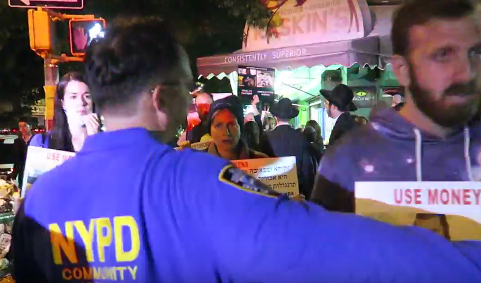 Animal Rights Activists Clash With Religious Jews in Brooklyn Over Ancient Chicken-Swinging Ritual