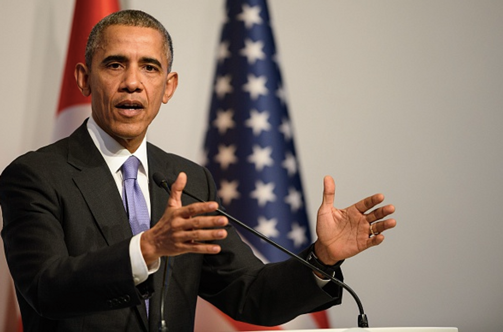 Despite Gripes Over Gitmo Staying Open, Obama Signs Defense Spending Bill