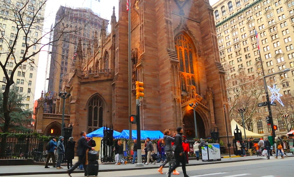 A Small Tent Beside an Iconic NYC Church Holds Powerful Symbols of Far Away Despair and Destruction