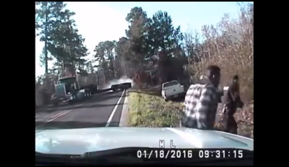 Dramatic Video Captures Texas Officers' Seriously Close Call While Helping Stranded Driver