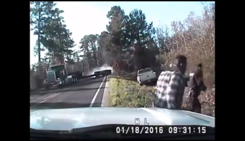 Dramatic Video Captures Texas Officers' Seriously Close Call While Helping Stranded Driver