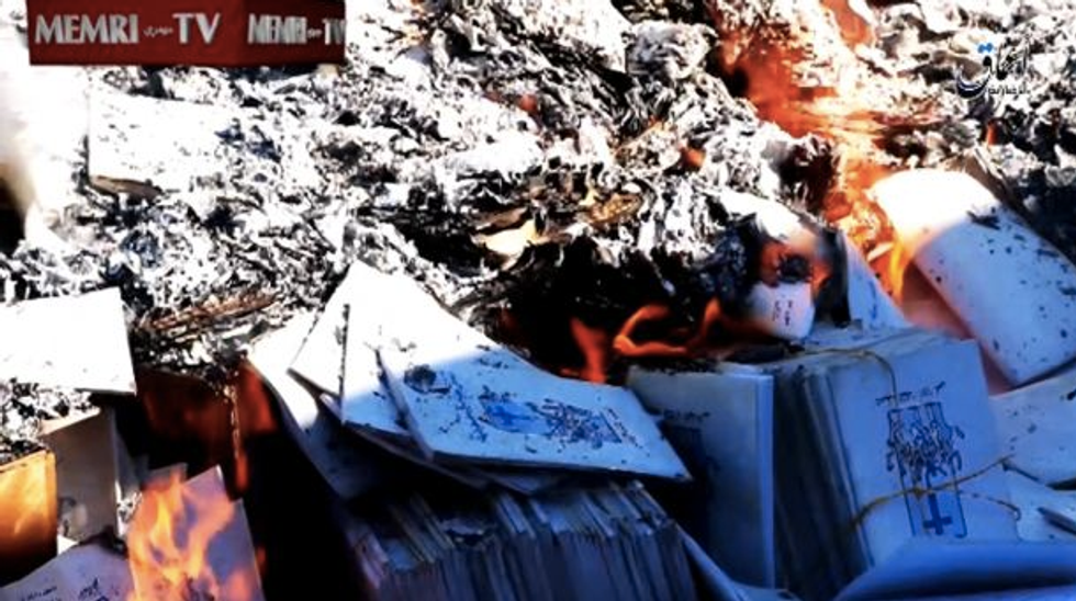 This Has Always Been Genocide': Video Surfaces of Islamic State's Bible Bonfire