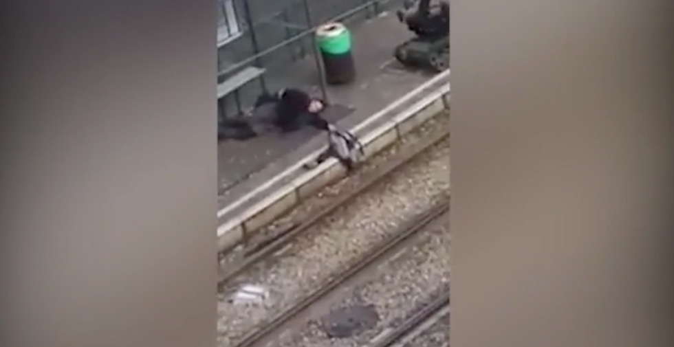 VIDEO: Bomb Disposal Robot Approaches Body of Wounded Terror Suspect Who Was Allegedly Carrying Bag of Explosives; Three Arrested in Brussels Raids