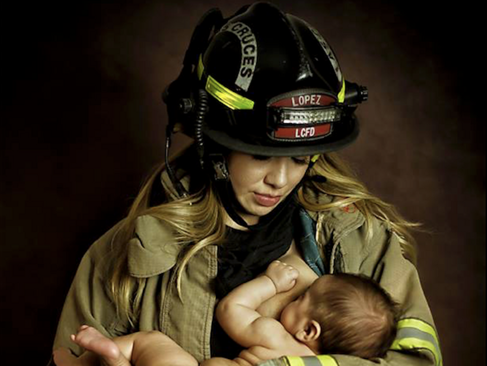 Firefighter Under Fire for This Photo Showing Wife Nursing Baby While Wearing His Uniform 