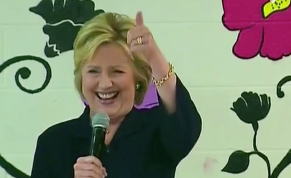 Clinton Laughs, Nods and Gives Thumbs Up When Woman Yells Something to Her in Spanish
