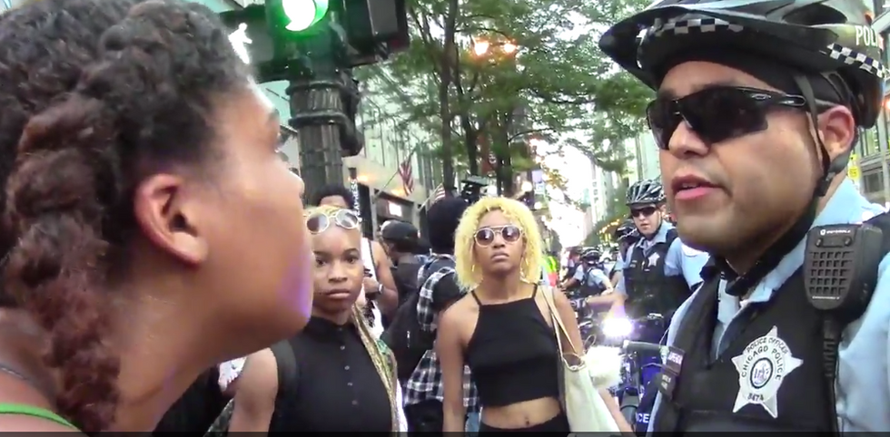 You're Dumb!': Watch How Officer Reacts to Furious Black Lives Matter Protester Screaming in His Face