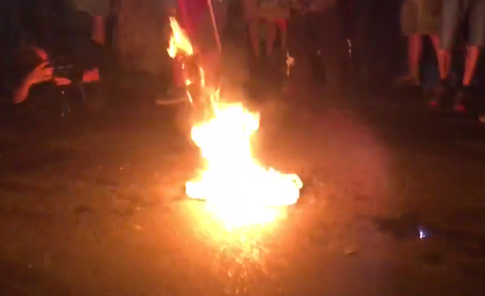 DNC Protester Tries to Stomp on Burning U.S. Flag, Gets Hit With Some Instant American Karma