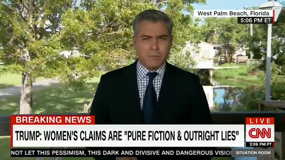 Here's the 'downright scary' sign CNN's Jim Acosta found at a Trump rally press table