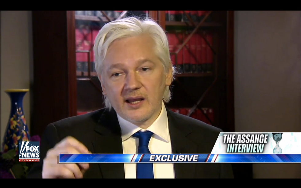 Watch: Julian Assange jokes with Sean Hannity about how easy it was to hack John Podesta's emails