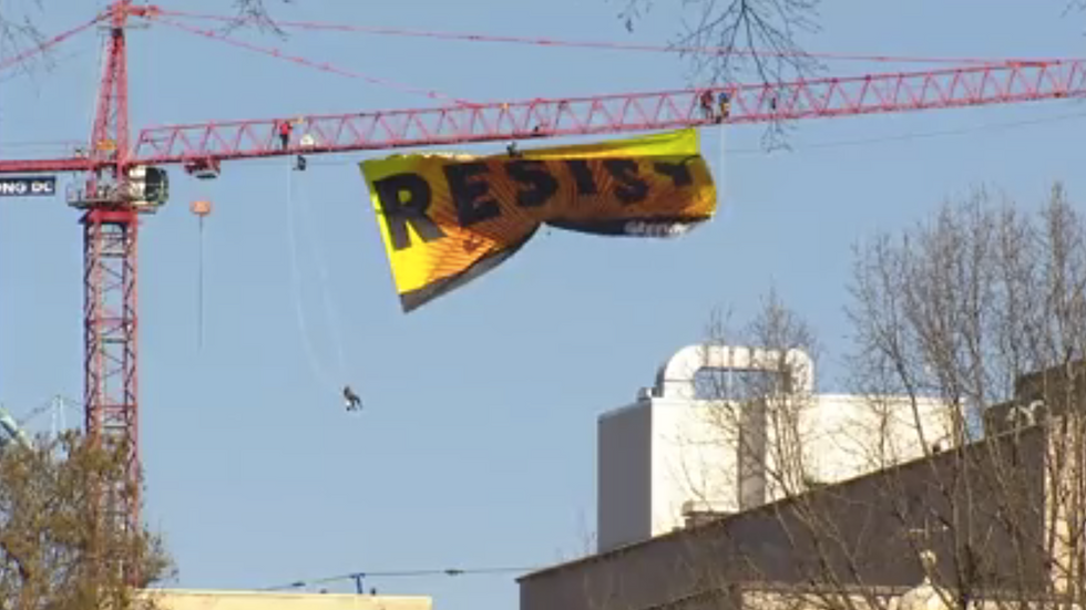 Watch: Environmentalist protesters scale 300-foot construction crane blocks from White House