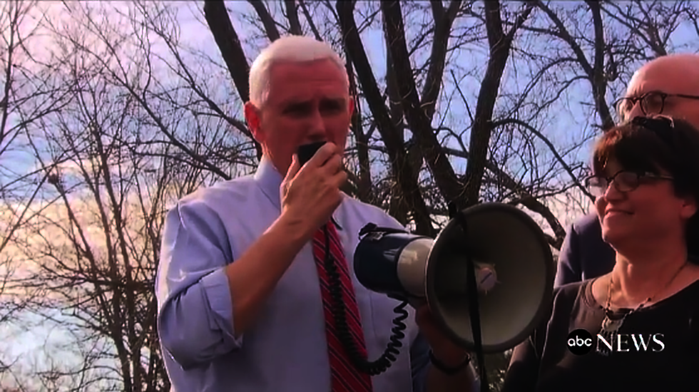 Mike Pence surprises volunteers at vandalized Jewish cemetery and helps make repairs