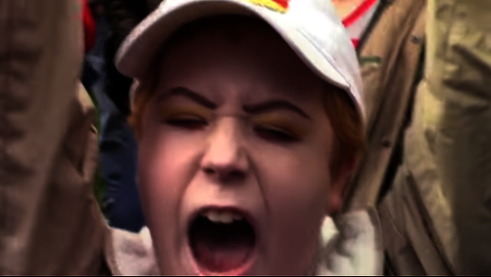 Radical anti-Trump protester screams like an insane person at March 4 Trump rally