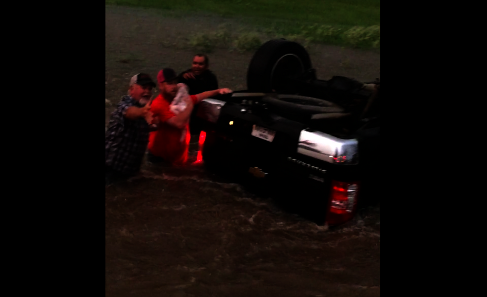 Watch these hero neighbors' dramatic rescue of infant and toddler trapped in rushing waters