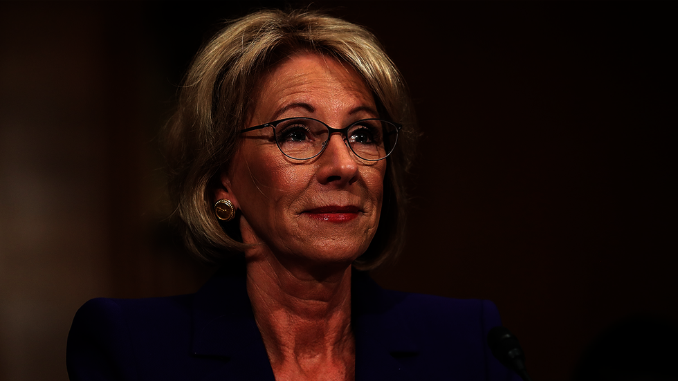 Secretary of Education praised students at graduation -- and then they booed her
