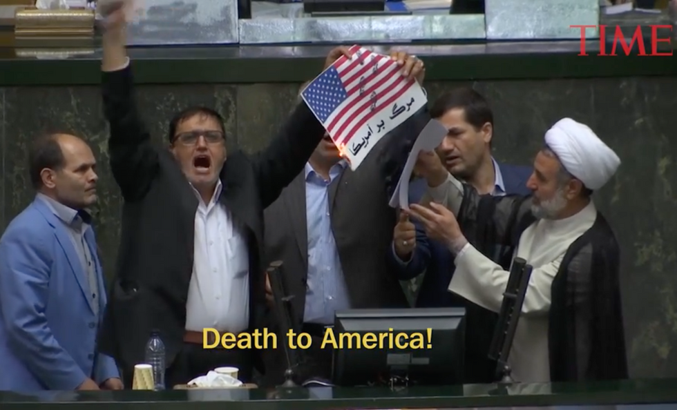 Iranian lawmakers burn paper US flag, chant 'Death to America' after Trump ends nuclear deal