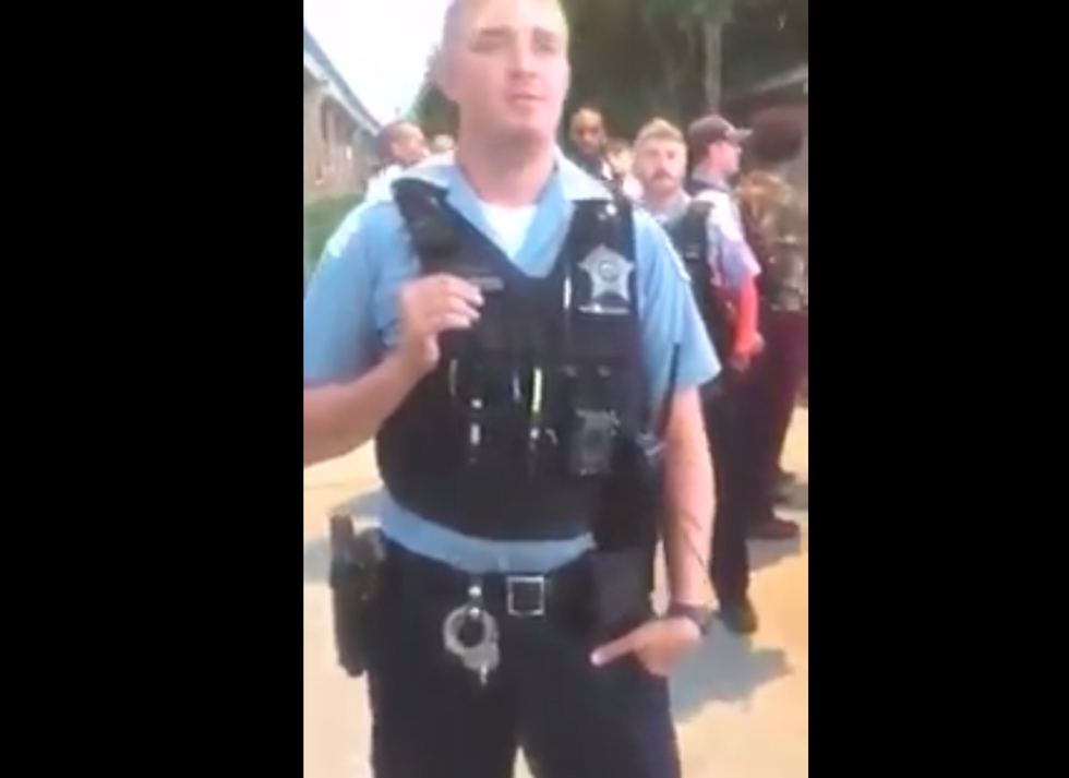 Chicago residents angrily confront cops for 'baiting' kids to steal with truck full of shoes