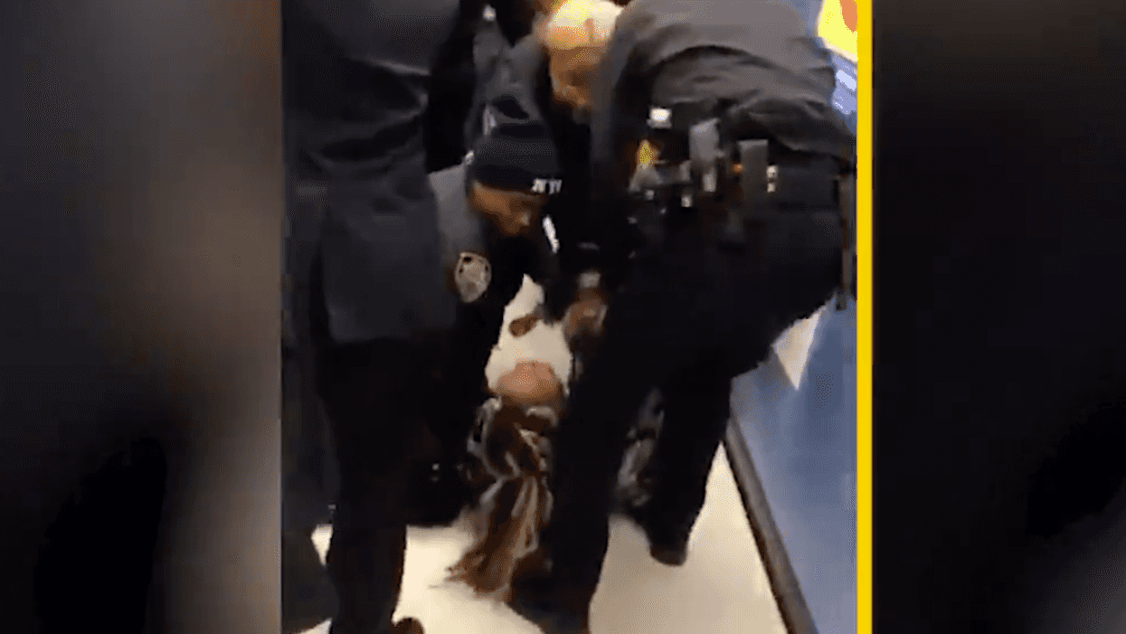 NYPD under fire for video showing officers wrestling baby away from woman