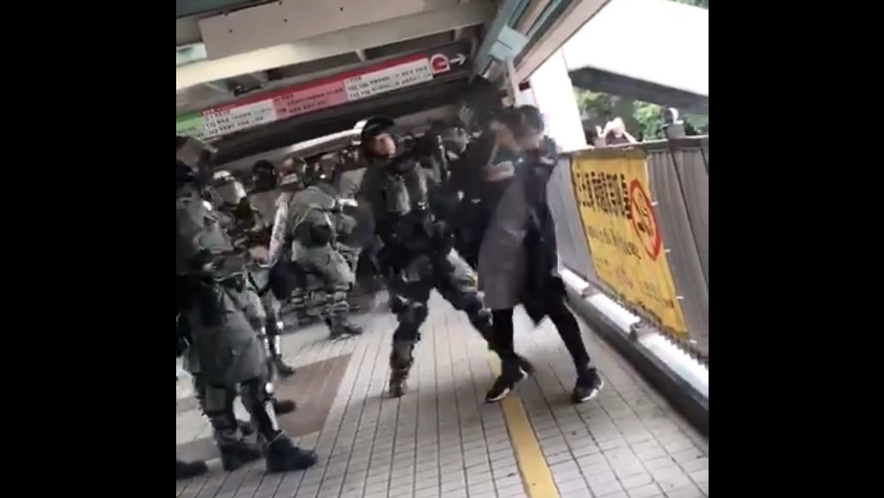 Video: Hong Kong police use pepper spray on a pregnant woman before tackling her to the ground