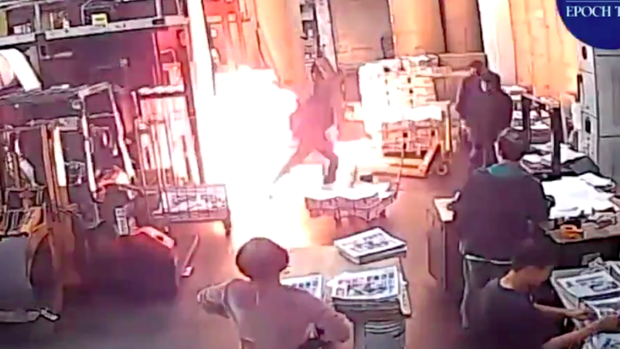 Masked men attack Hong Kong newspaper facility, set fire to printing presses, papers