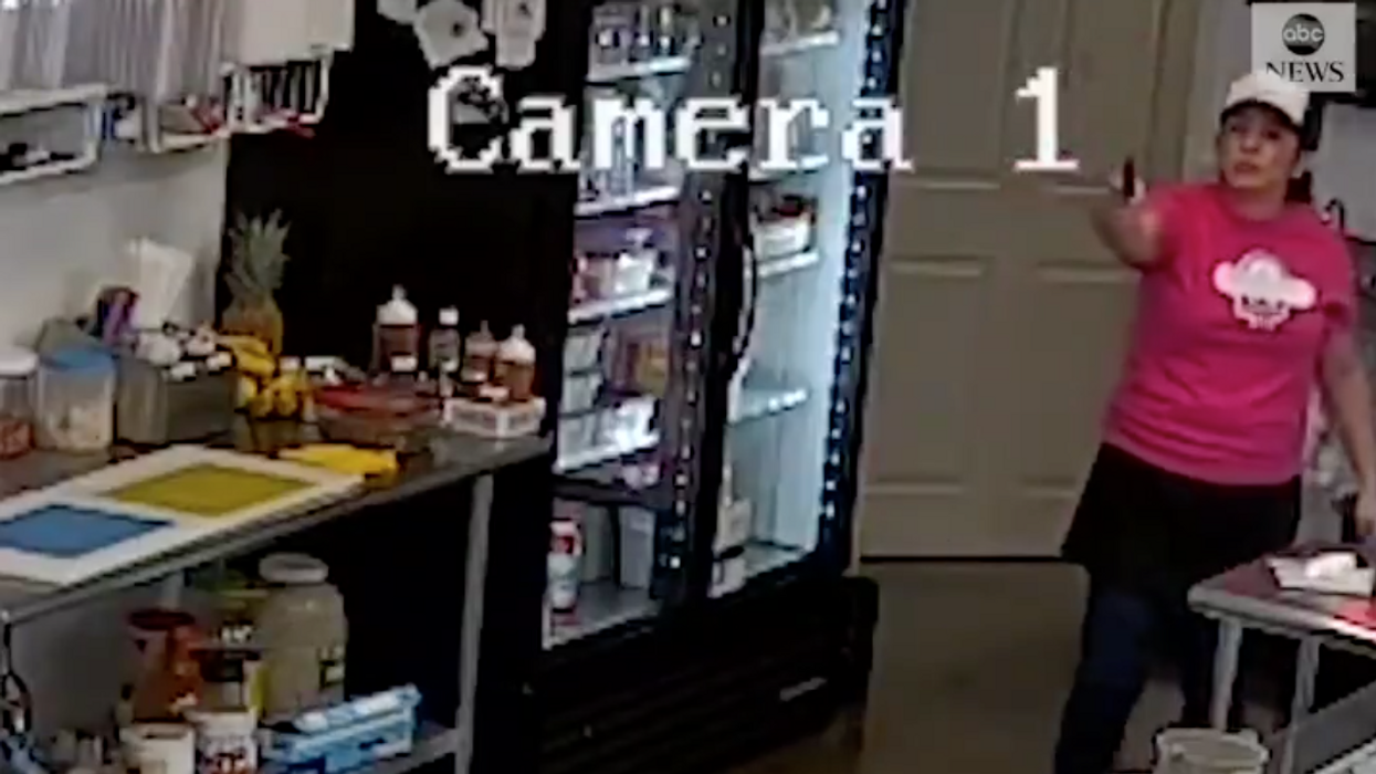 Surveillance video shows ice cream shop owner with gun fighting back against would-be robber