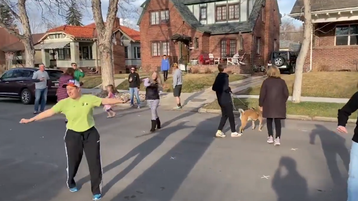 VIDEO: Denver neighbors hold a 'social distancing dance party' in the street to beat back the coronavirus isolation blues