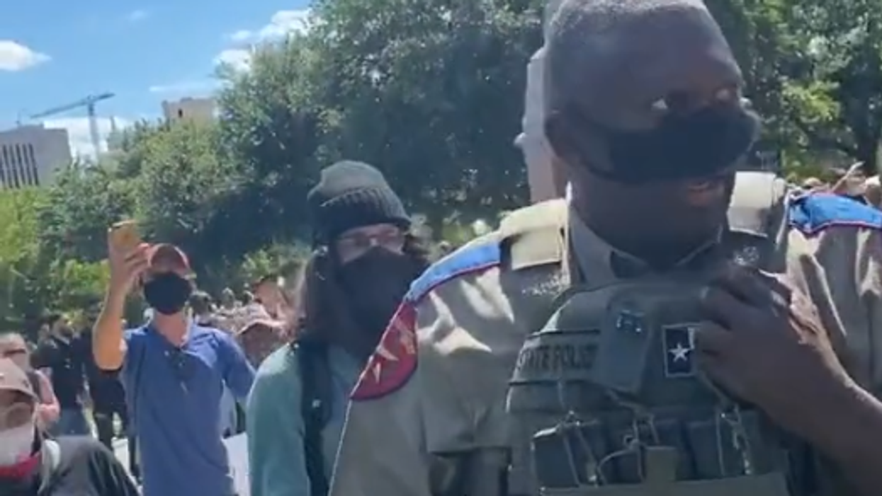 Video shows protesters single out, surround black state trooper — then they hurl racist slurs