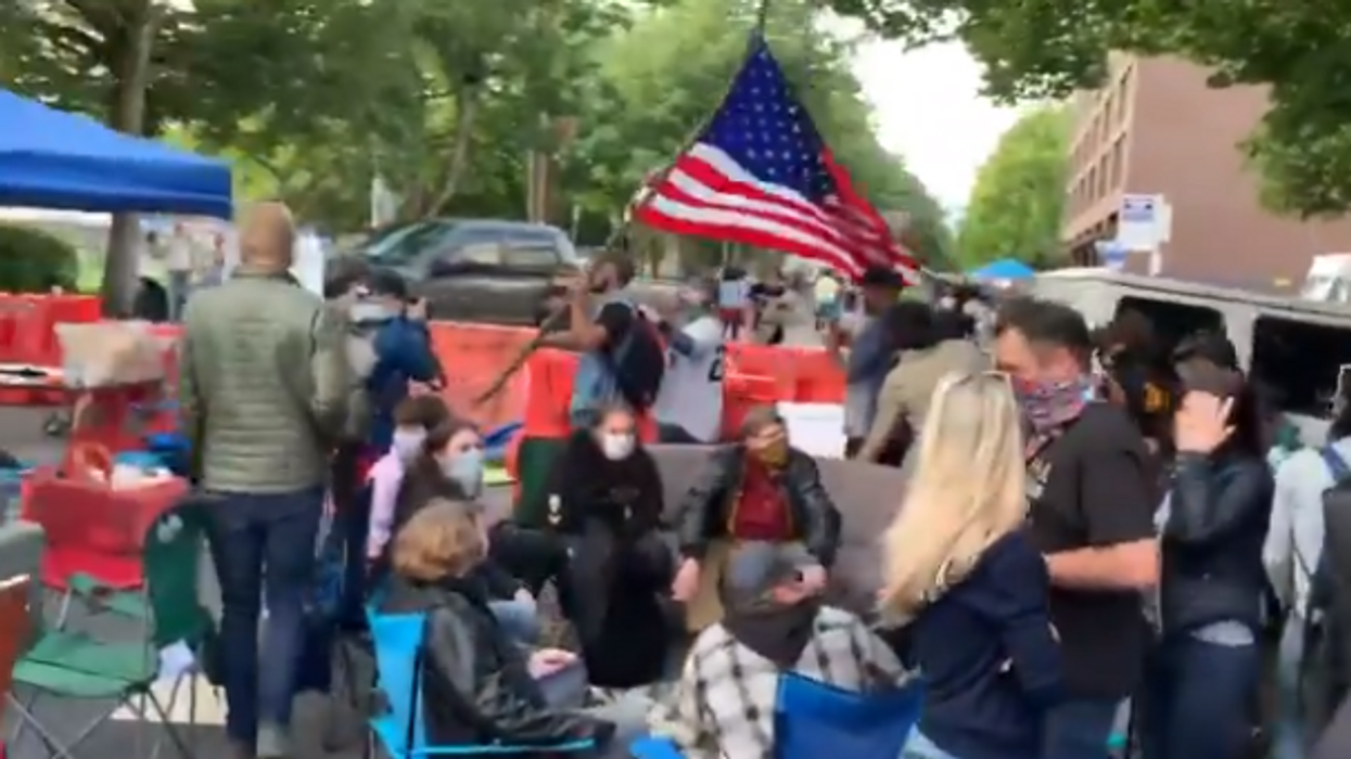 CHAZ citizens torment black man holding American flag in autonomous zone, call him a 'race traitor'