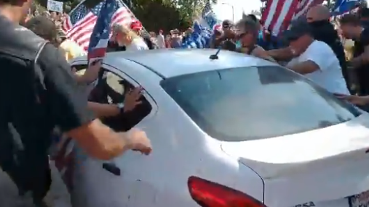 Woman charged with attempted murder after plowing through crowd of Trump supporters with car