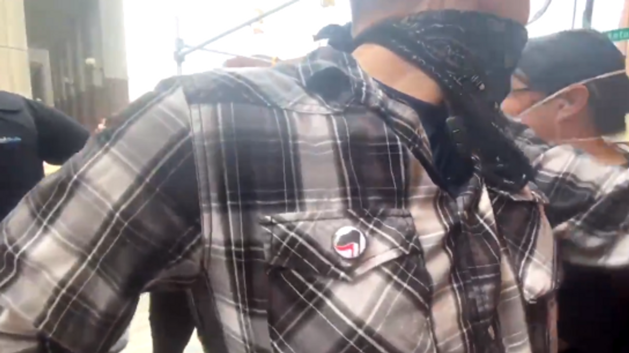 Antifa 'security' attacks video journalist, steals camera during anti-eviction march in Detroit
