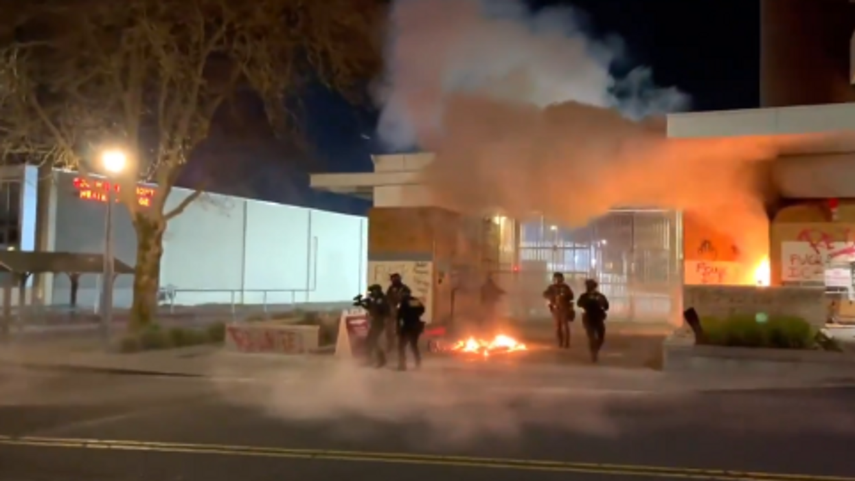 Portland rioters barricade door and set fire to ICE building with federal agents inside: 'Burn the precinct to the ground!'