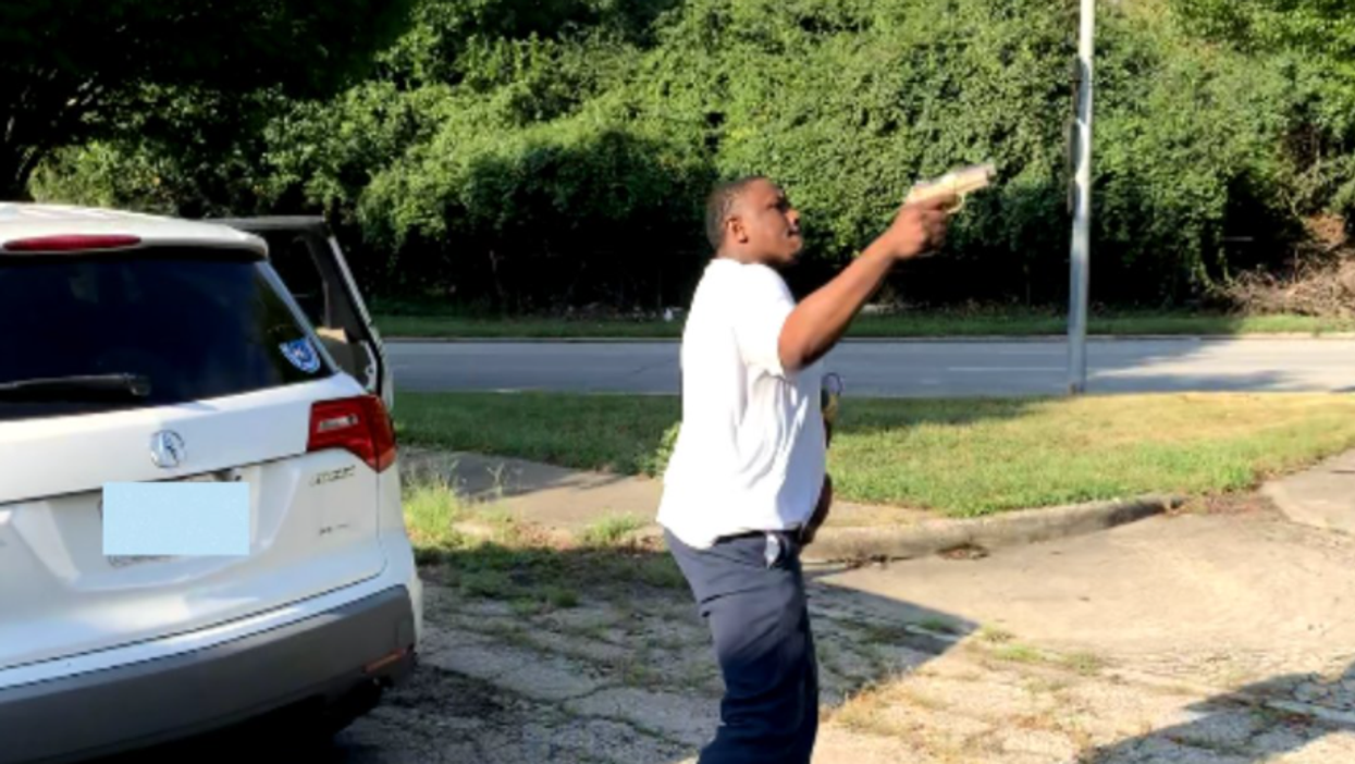 Shocking photo shows man shooting women over road rage incident while holding baby