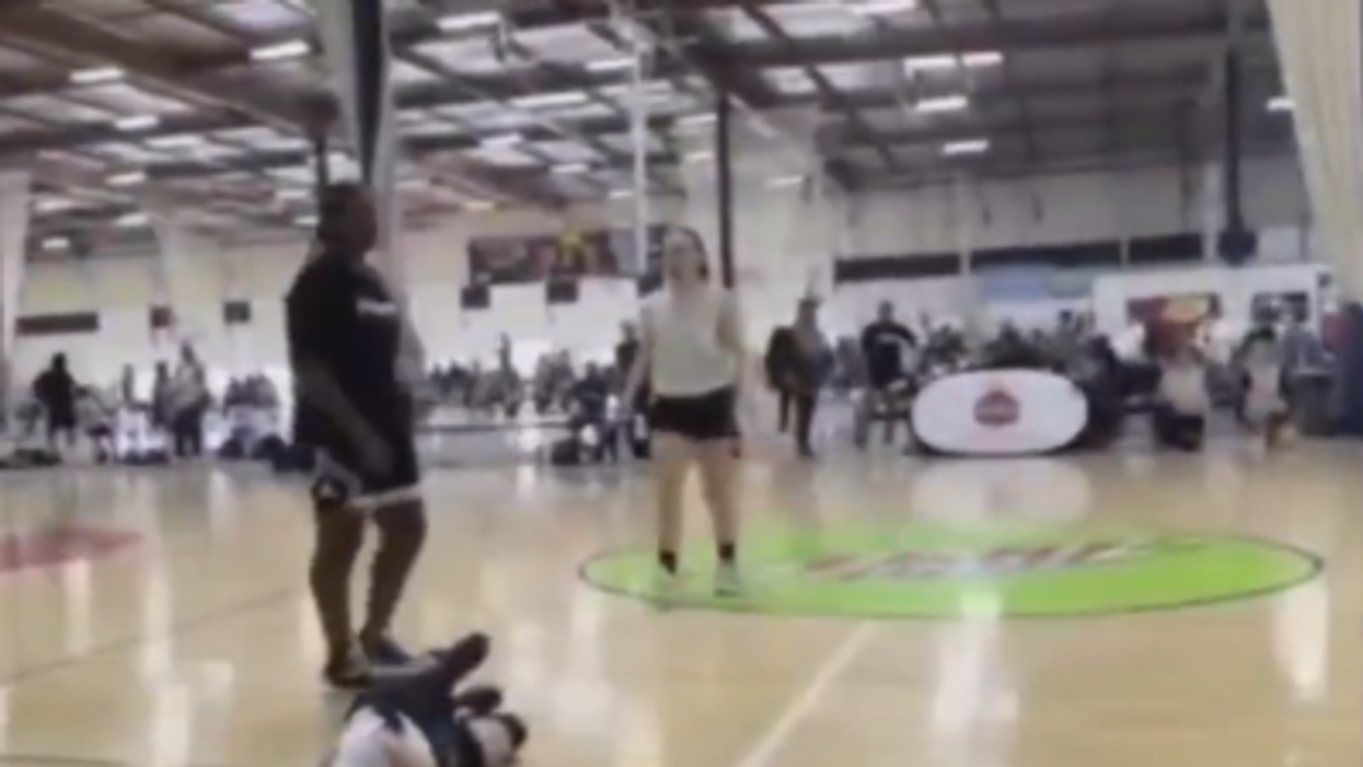 Teen brutally sucker-punches girl. Mother charged for allegedly telling daughter to 'hit' opponent. Assailant's father, an ex-NBA player, apologizes.