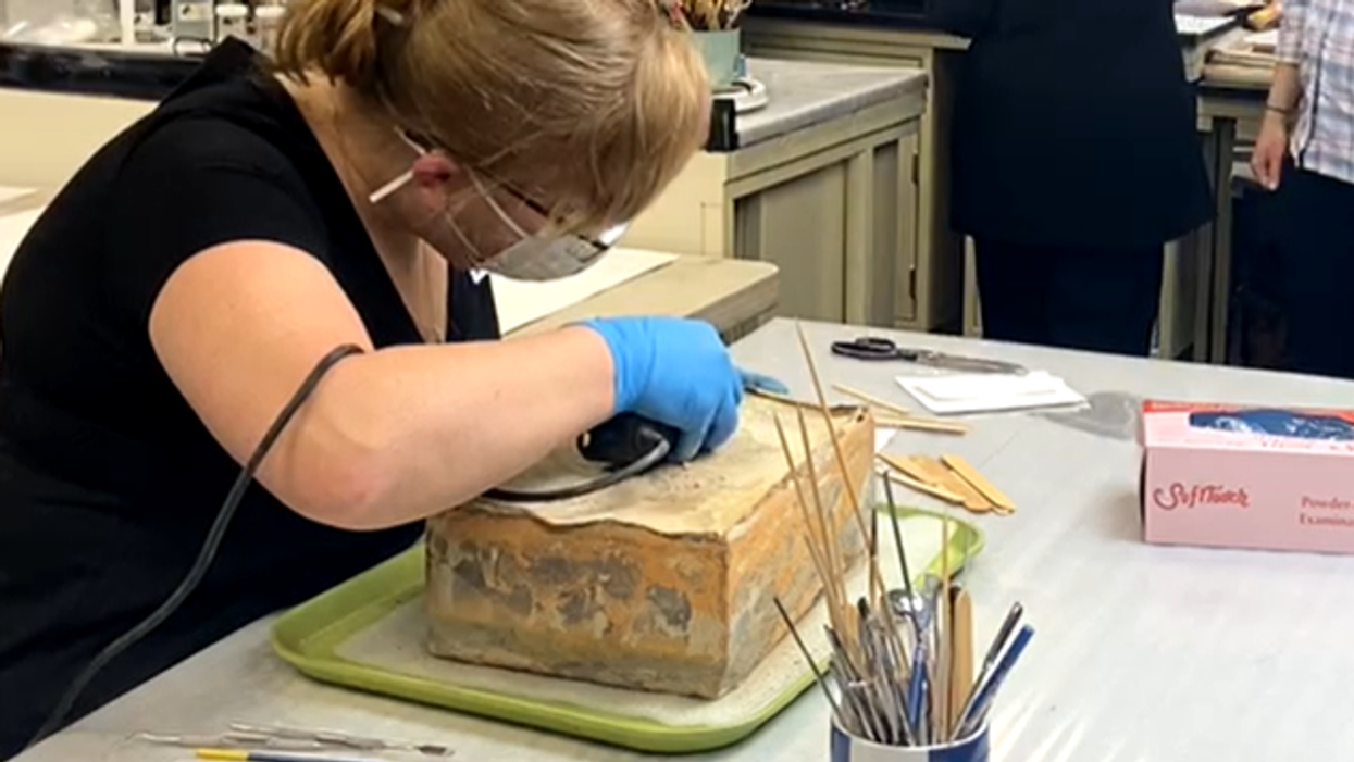 Preservationists reveal contents of 1887 time capsule crews found hidden inside base of Robert E. Lee statue