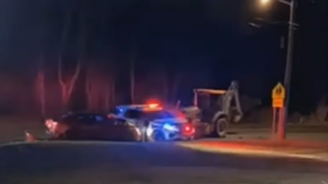 Shocking video shows backhoe rampage. Driver plows into cars and houses before being fatally shot by police.