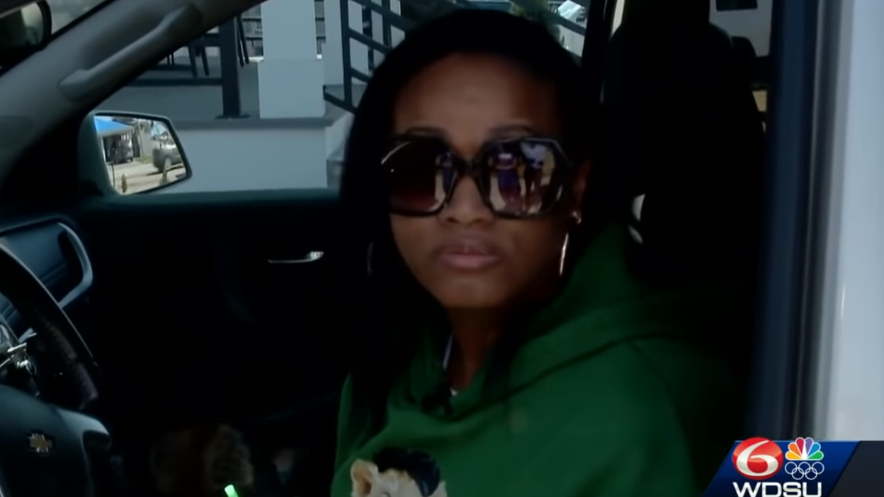 Mom, Iraq war vet takes action when would-be carjacker approaches. She points a gun in his face and says, 'It's locked and loaded.'